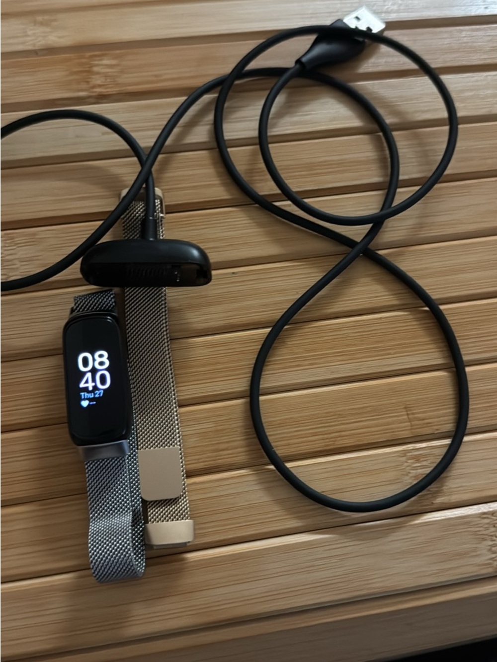 fitbit Inspire 3 with Silver and Gold Mesh Band and Black Charger Cable